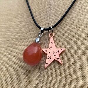 Handmade Teardrop Stone Amulet with etched Star Charm